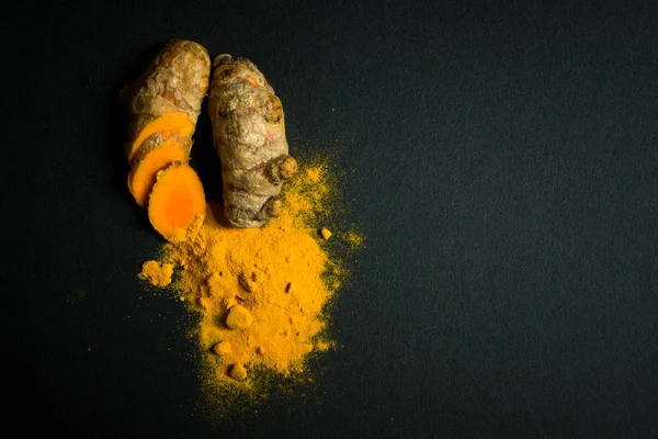 Turmeric roots and turmeric powder — Stock Photo, Image