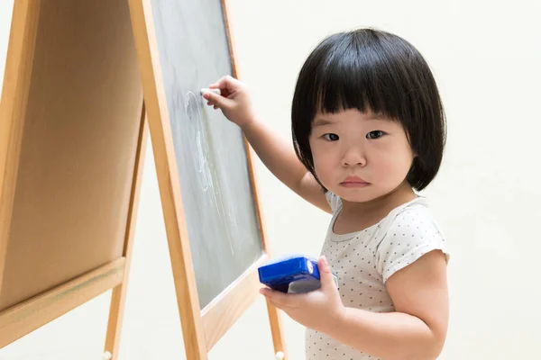 Toddler drawing on chalkboard — Stock Photo, Image