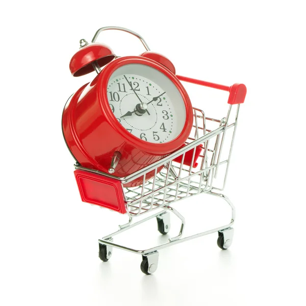 Red alarm clock in shopping cart — Stock Photo, Image
