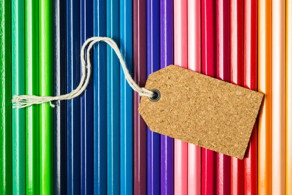 Blank label tag on color pencils — Stock Photo, Image