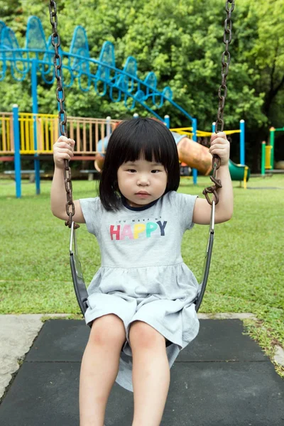 Asian child on swing — Stock Photo, Image