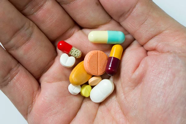 Hand full of pills — Stock Photo, Image