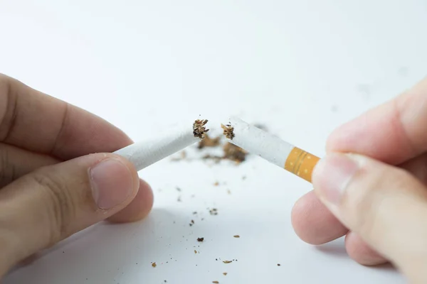 Quit smoking concept by breaking the cigarette — Stock Photo, Image