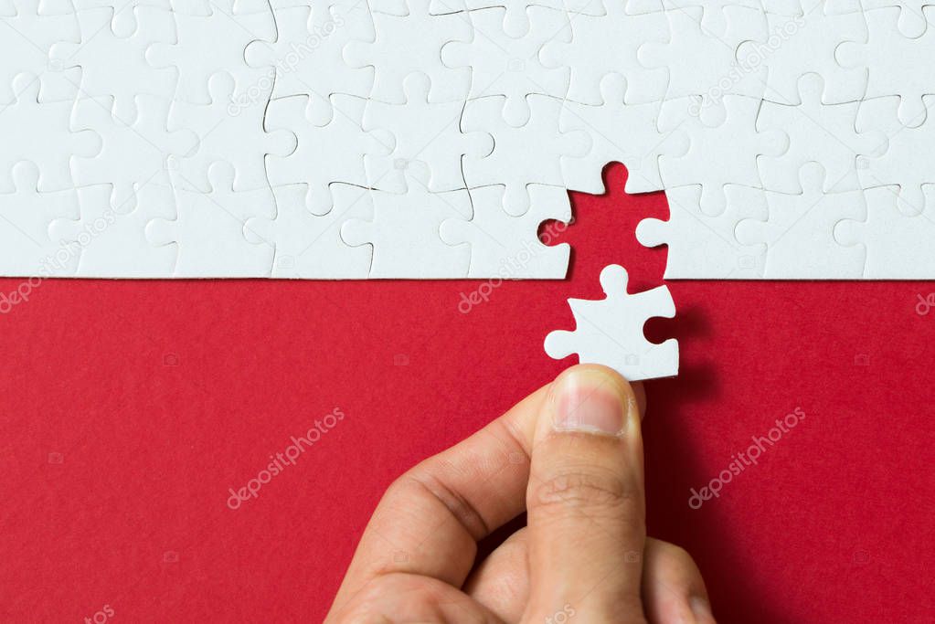Red background made from jigsaw puzzle
