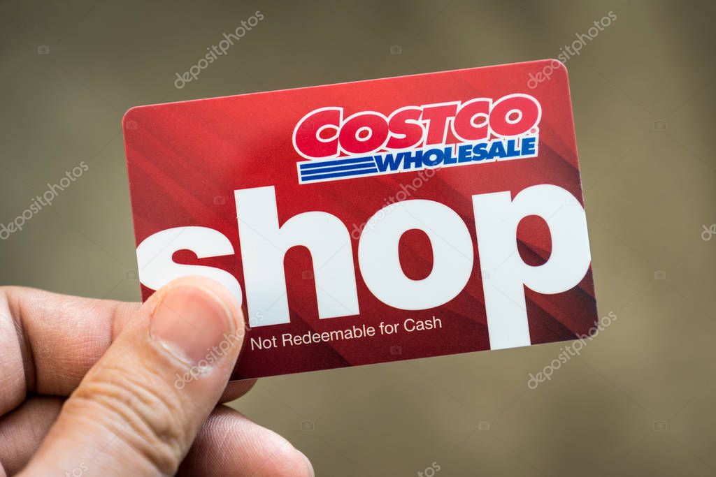Detroit, USA - Sep 29, 2019 : Hand holding a Costco wholesale red color gift card isolated