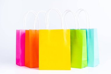 Colorful shopping bags standing in a row