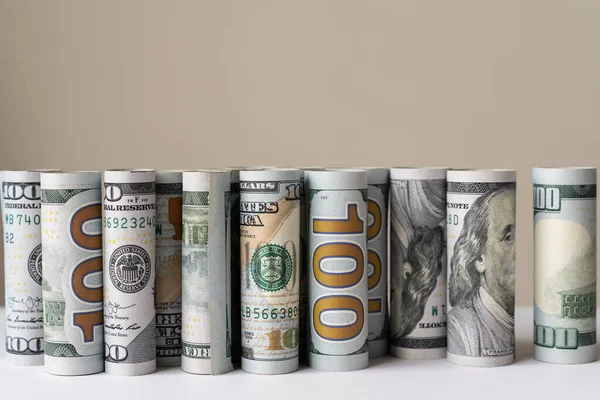 Rolls of US dollar bill in a row — Stock Photo, Image