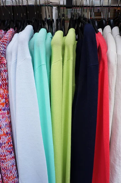 Pullovers on hangers. — Stock Photo, Image