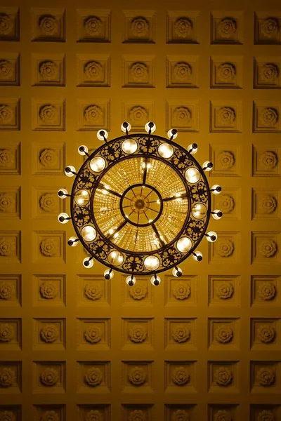 Chandelier on decoarted ceiling — Stock Photo, Image