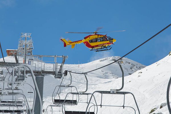 Rescue helicopter in the mountains