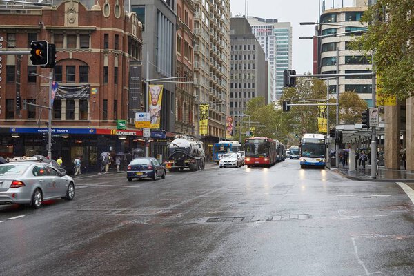 SYDNEY, AUSTRALIA - APRIL 3, 2014: View from Sydney Park Street with buildings and traffic in rainy weather