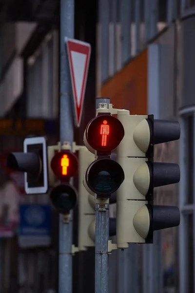 Red traffic light in urban street