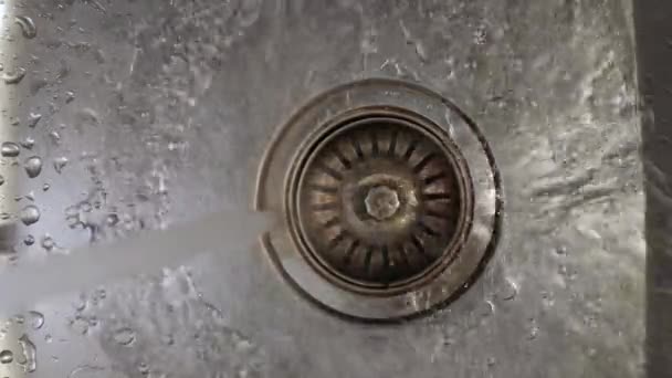 Kitchen sink with flowing water, open tap — Stock Video