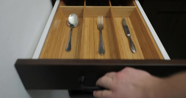Minimalist kitchen tools put away in a drawer — Stock Video