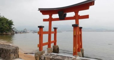 Tori gate at the water in Miyajima, Japan
