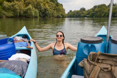 Canoe tour river swim clipart