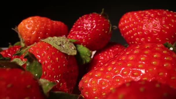 Strawberries in a pile probe lens macro — Stock Video