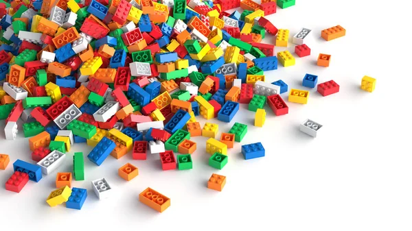 Pile of colored toy bricks on white background. — Stock Photo, Image