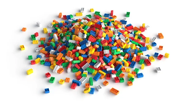 Pile of colored toy bricks isolated on white background. — Stock Photo, Image
