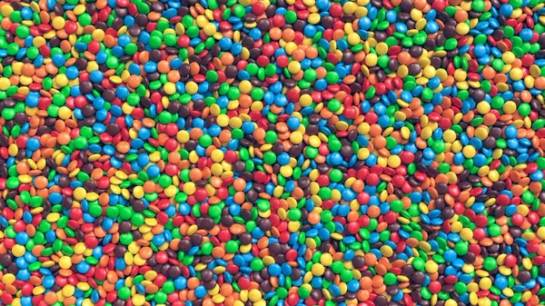 Obrovskou hromadu barevných vrstvou čokoládové bonbóny pozadí — Stock fotografie