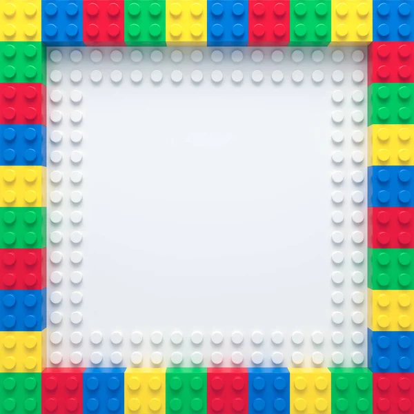 Cadre de briques jouet colorées sur plaque de construction blanche — Photo