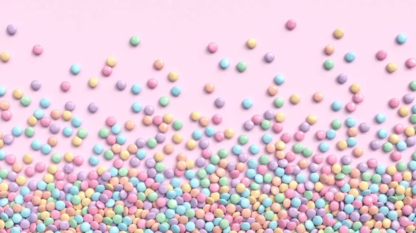 Coloridos caramelos recubiertos de chocolate en tonos pastel esparcidos sobre fondo rosa — Foto de Stock