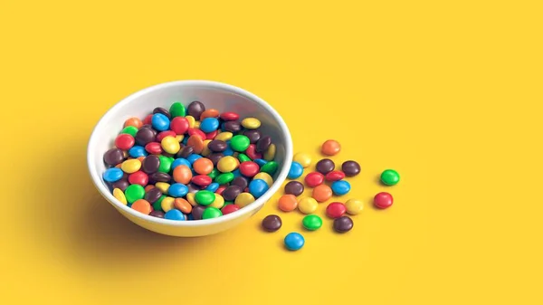 Coloridos caramelos recubiertos de chocolate en un tazón blanco aislado sobre fondo amarillo — Foto de Stock