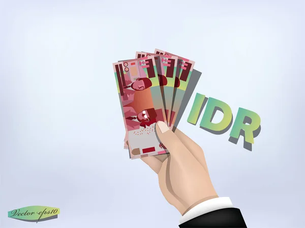 Indonéz rupiahs pénzt papír kéznél, a készpénz a kezét — Stock Vector