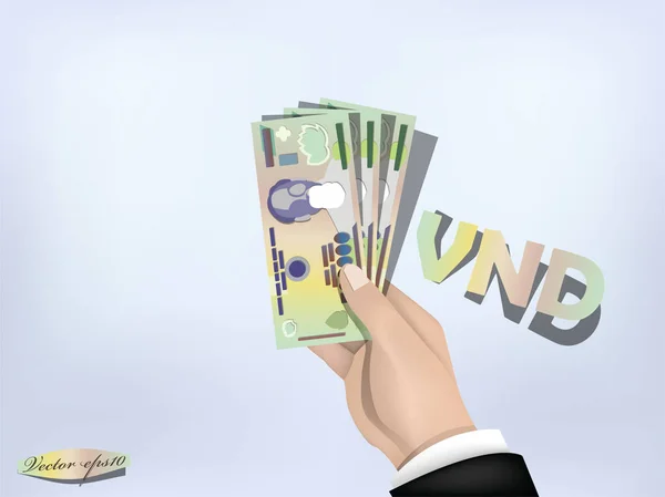 Vietnam dong pénz papír kéznél, a készpénz a kezét — Stock Vector