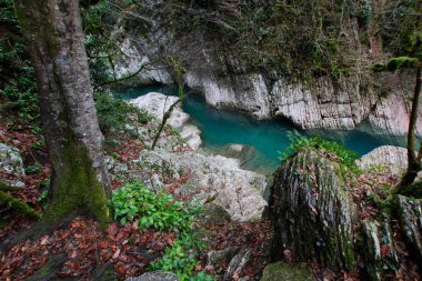 Khosta river flowing along the steep banks.