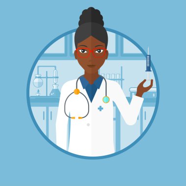 Laboratuvarda şırınga ile laboratuvar asistanı.