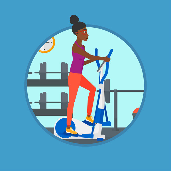 Woman exercising on elliptical trainer.