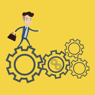 Cogwheels üzerinde çalışan iş adamı.