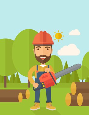 Oduncu bir ağaç tarafından chainsaw keser.