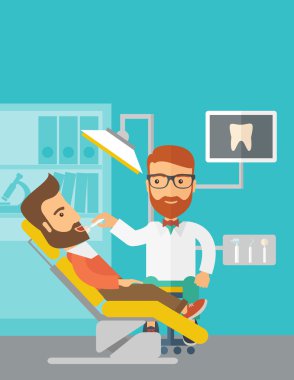 Dentist man examines a patient teeth in the clinic