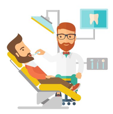 Dentist man examines a patient teeth in the clinic