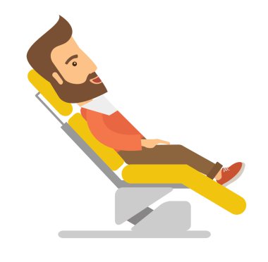 Man lying in dentist chair.