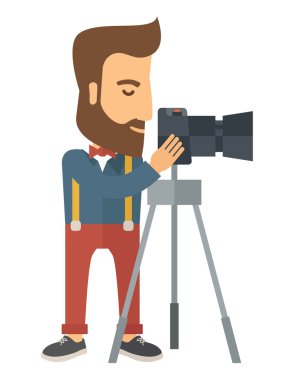 Photographer Standing preparing his camera with tripod.
