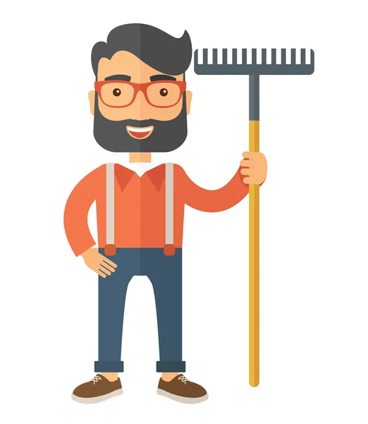Man with a mustache holding rake. — Stock Photo, Image