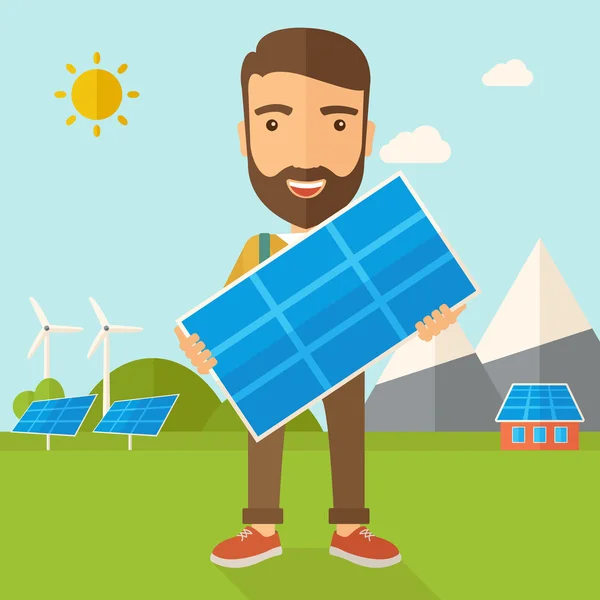 Hombre sosteniendo un panel solar . — Foto de Stock