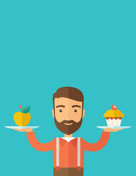 Adam onun iki eli cupcake ve elma ile taşır. — Stok fotoğraf