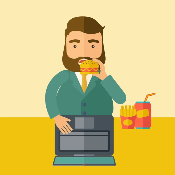 Young fat guy eating while at work. — Stock Photo, Image