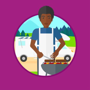 Camper van önünde Barbekü partisi adam.