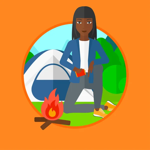 Woman kindling campfire vector illustration. — Stock Vector