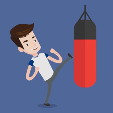 Man exercising with punching bag. clipart
