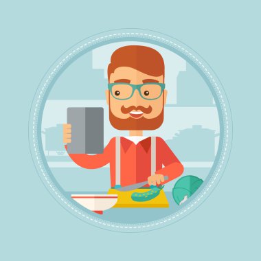 Tablet bilgisayar salata tarifi arayan adam.