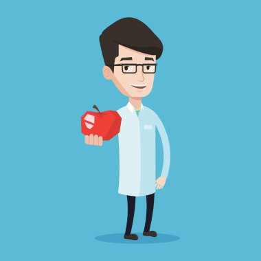 Beslenme uzmanı sunan taze kırmızı elma.