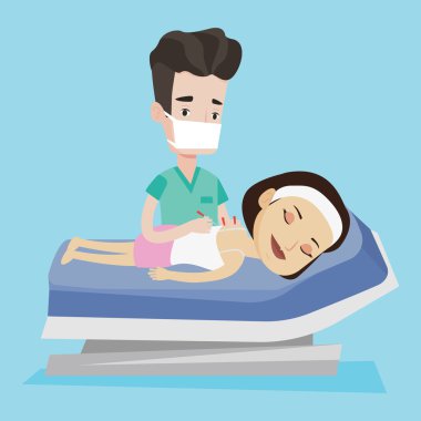 Akupunktur Uzmanı Doktor yapma akupunktur tedavisi.