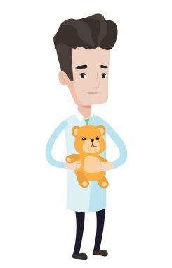 Çocuk doktoru doktor holding oyuncak ayı.