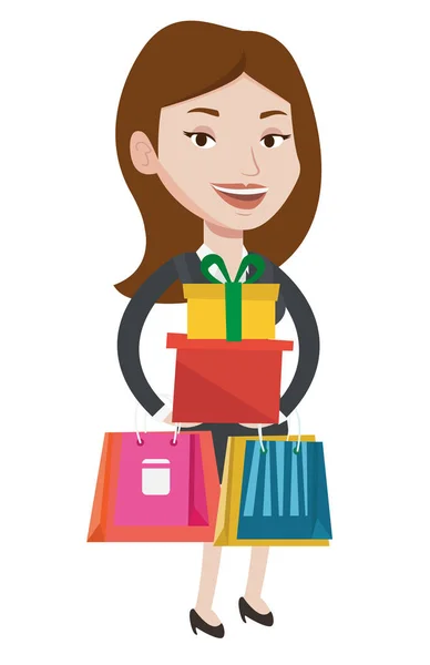 Mujer feliz sosteniendo bolsas de compras y cajas de regalo . — Vector de stock